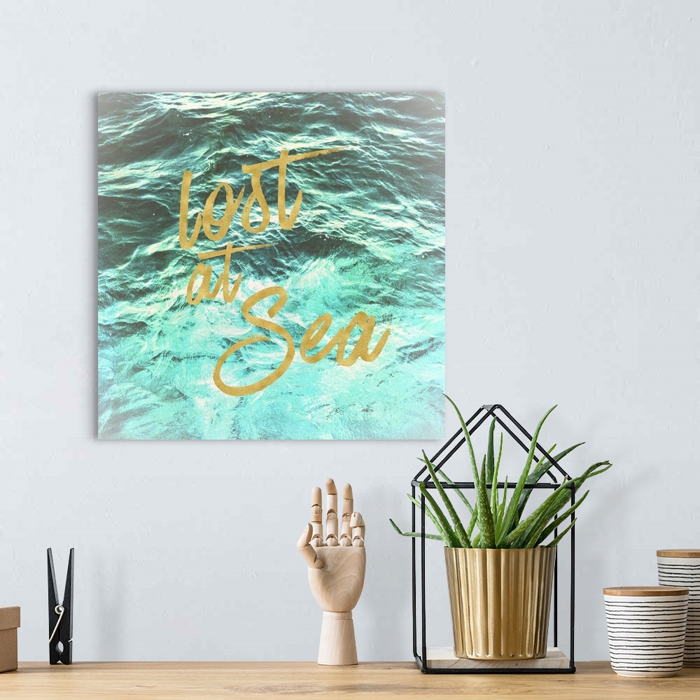 A bohemian room featuring "Lost at Sea" in golden script over an image of rippling ocean waves.