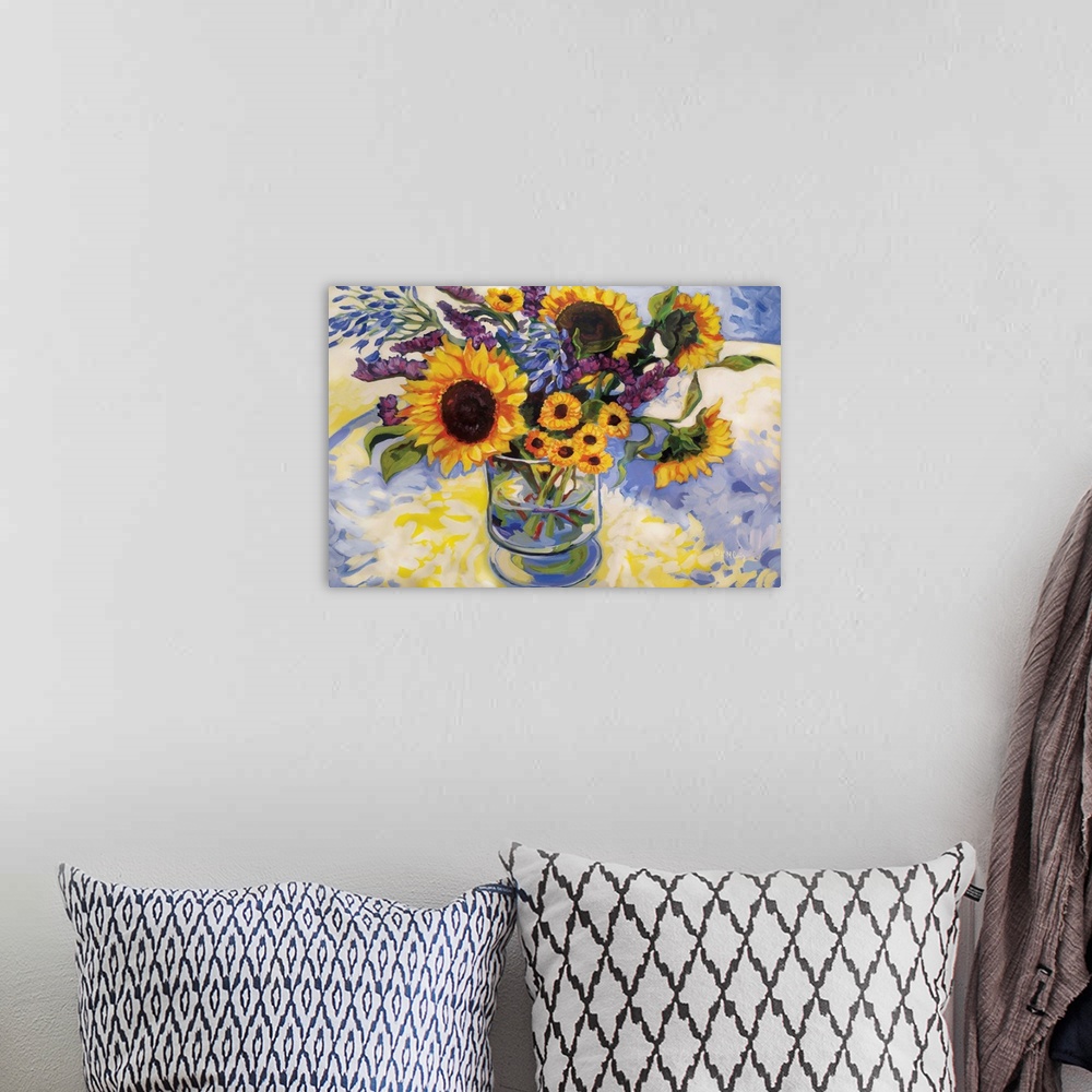 A bohemian room featuring Contemporary artwork of a bouquet of sunflowers in a vase.