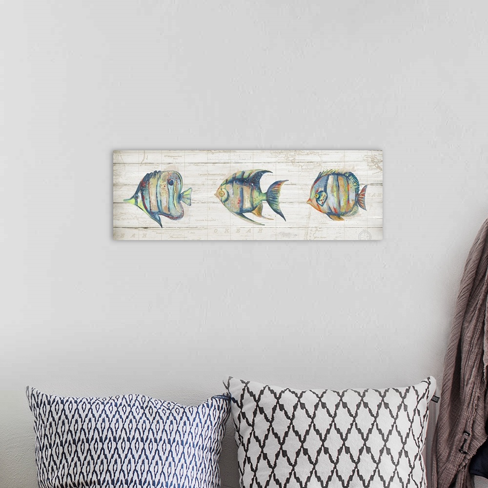 A bohemian room featuring Creative artwork of a row of three colorful fish with red speckled paint, on a faded neutral colo...