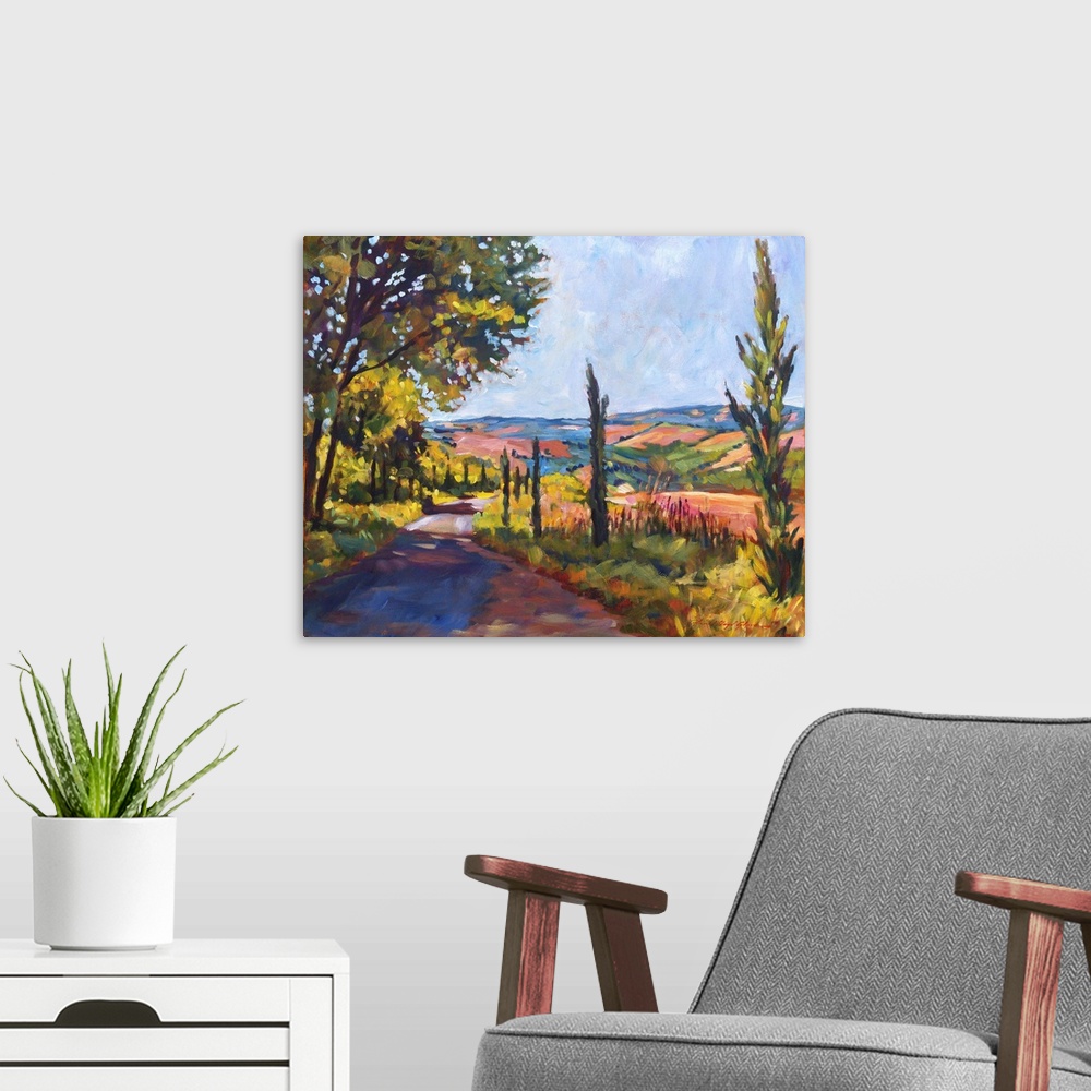 A modern room featuring Painting of a road through the Tuscan countryside.