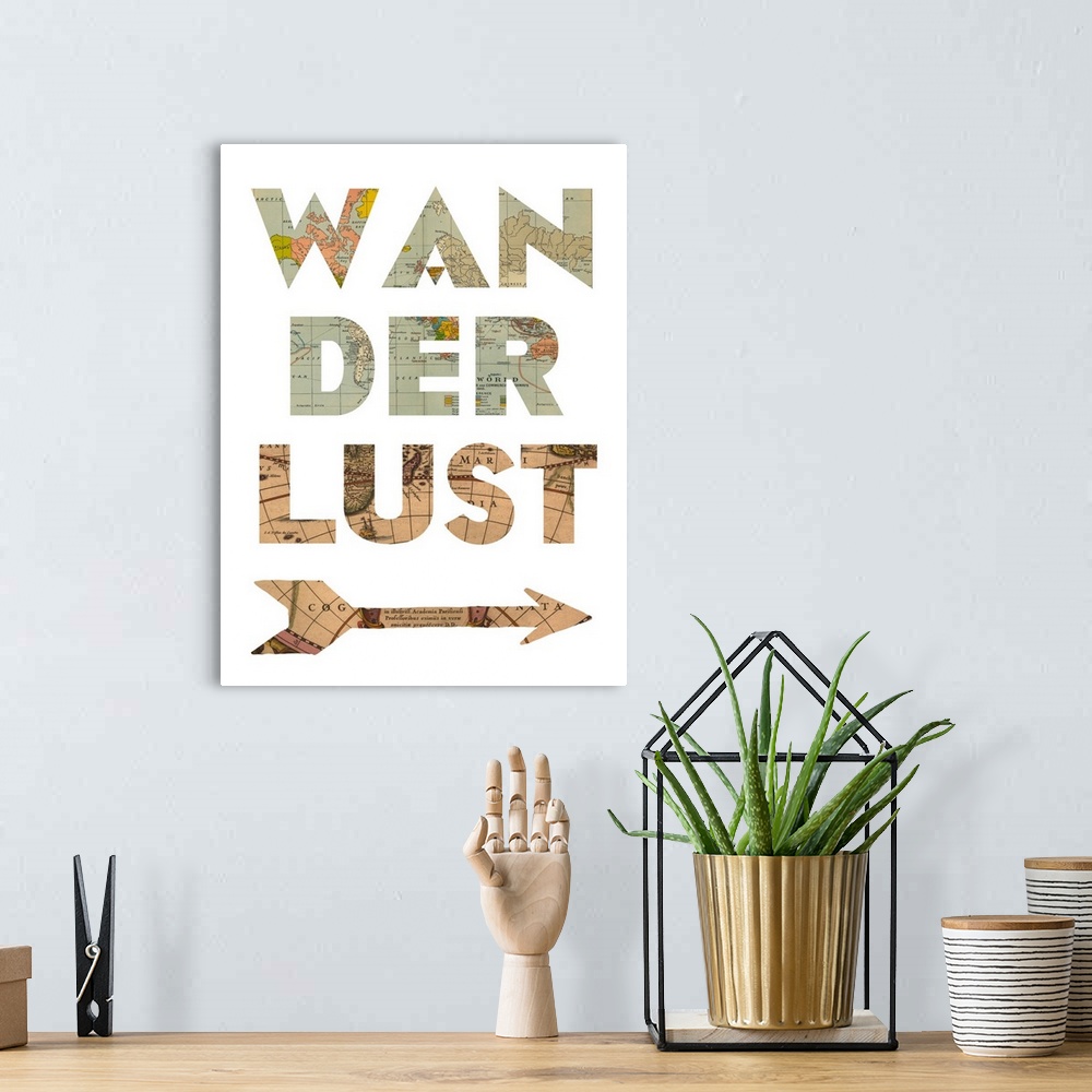 A bohemian room featuring The word "wanderlust" and an arrow shape made from a vintage map.