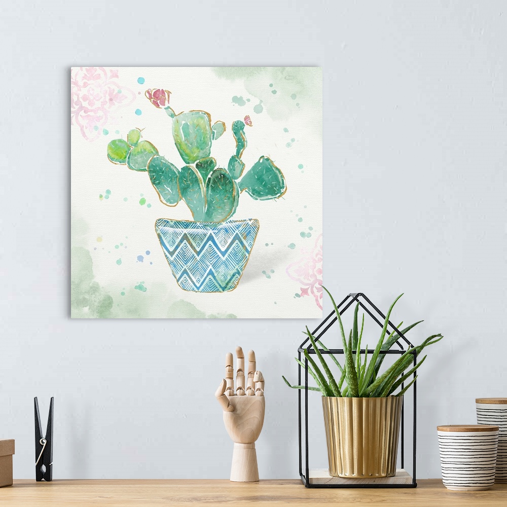 A bohemian room featuring A watercolor painting of a cactus in a colorful patterned flowerpot with gold accents.