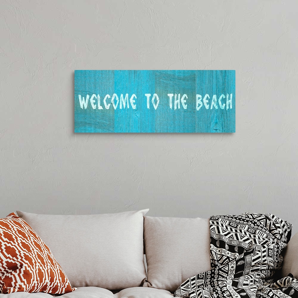 A bohemian room featuring Welcome to the Beach