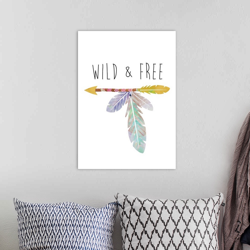 A bohemian room featuring An arrow with long feathers under the words "Wild and Free."
