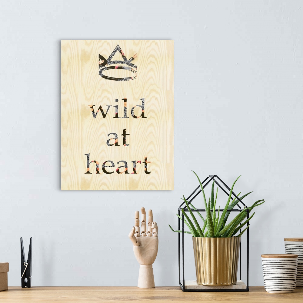 A bohemian room featuring "Wild at heart" with a crown design on woodgrain.