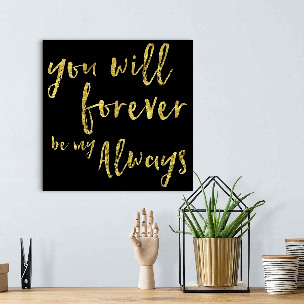 A bohemian room featuring Gold hand-lettered text on black.