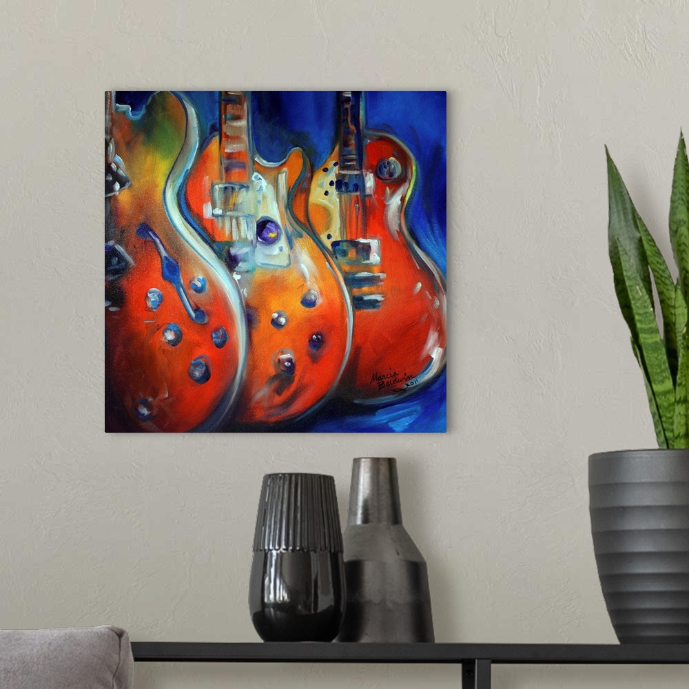 A modern room featuring Square painting in red, blue, yellow, orange, and green hues of three guitars standing up in a row.
