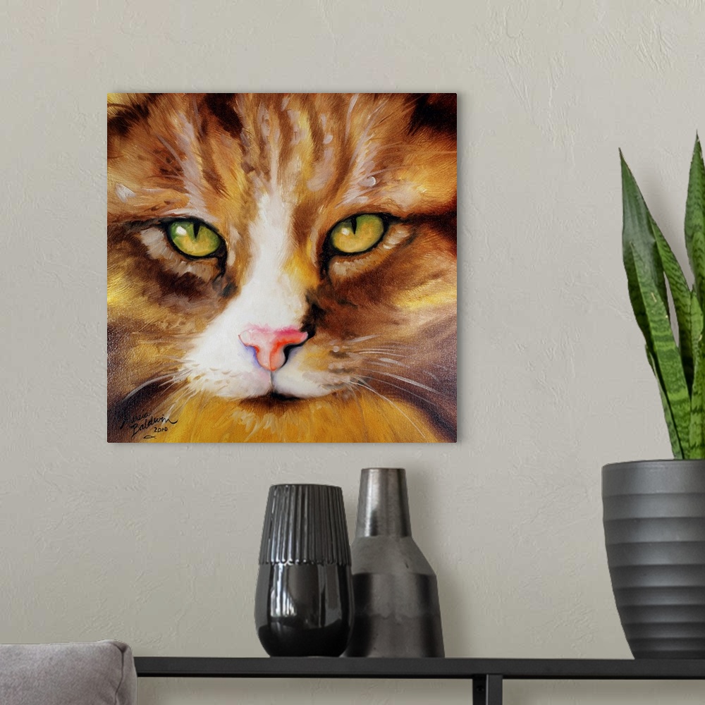 A modern room featuring Close-up painting of a brown and yellow striped kitten's face with green and yellow eyes on a squ...