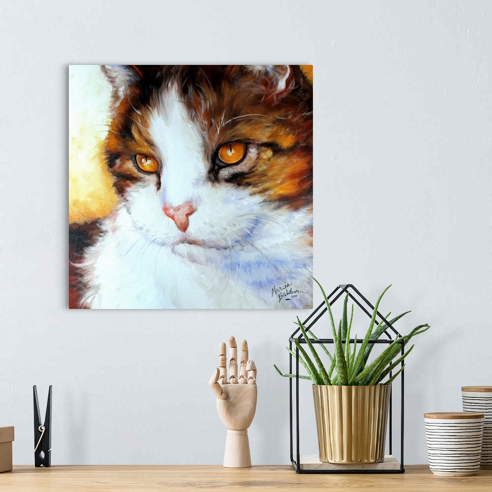 A bohemian room featuring Painting of a brown, yellow, and white kitten with cool blue shadows on a square background.