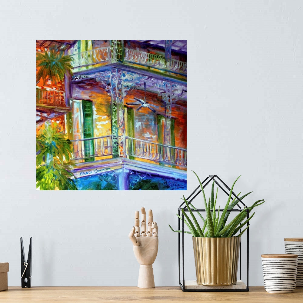 A bohemian room featuring Contemporary square painting depicting a scene in the French Quarters of New Orleans.