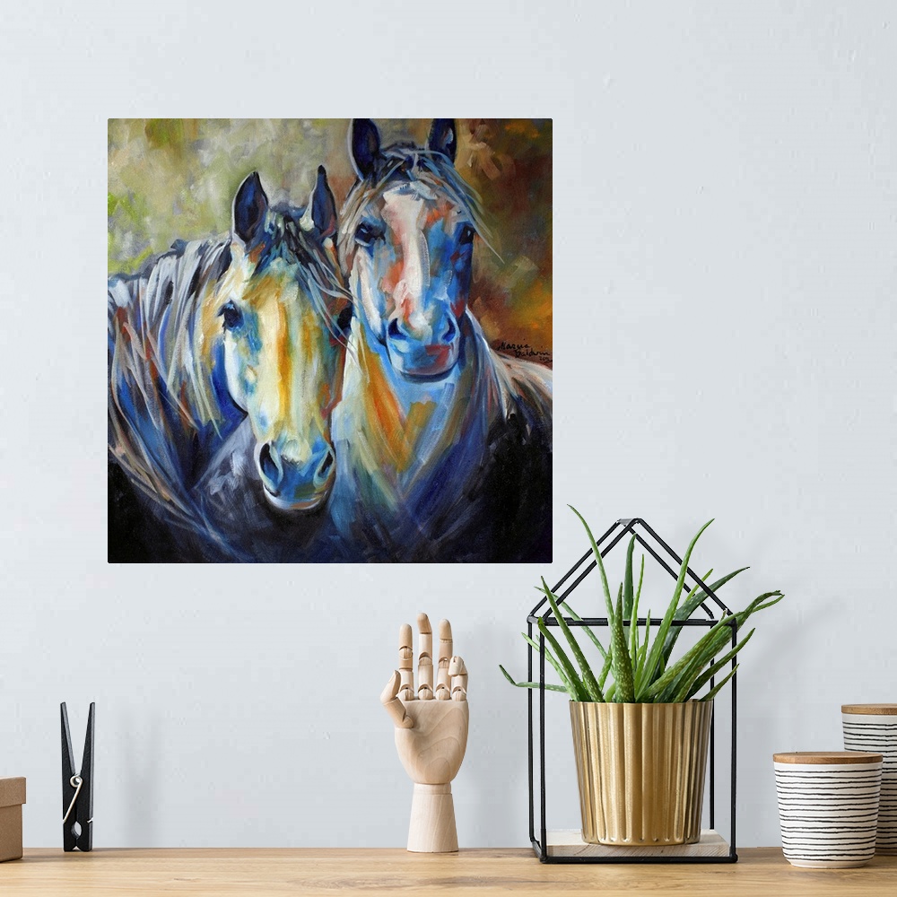 A bohemian room featuring Painting of two horses standing side by side in earth tones on a square background.