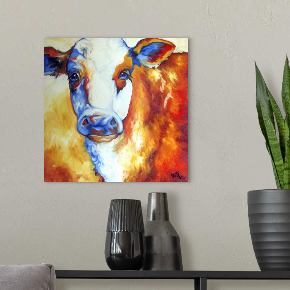 A modern room featuring Contemporary painting of a cow made with orange, yellow, red, white, and blue hues on a square ba...