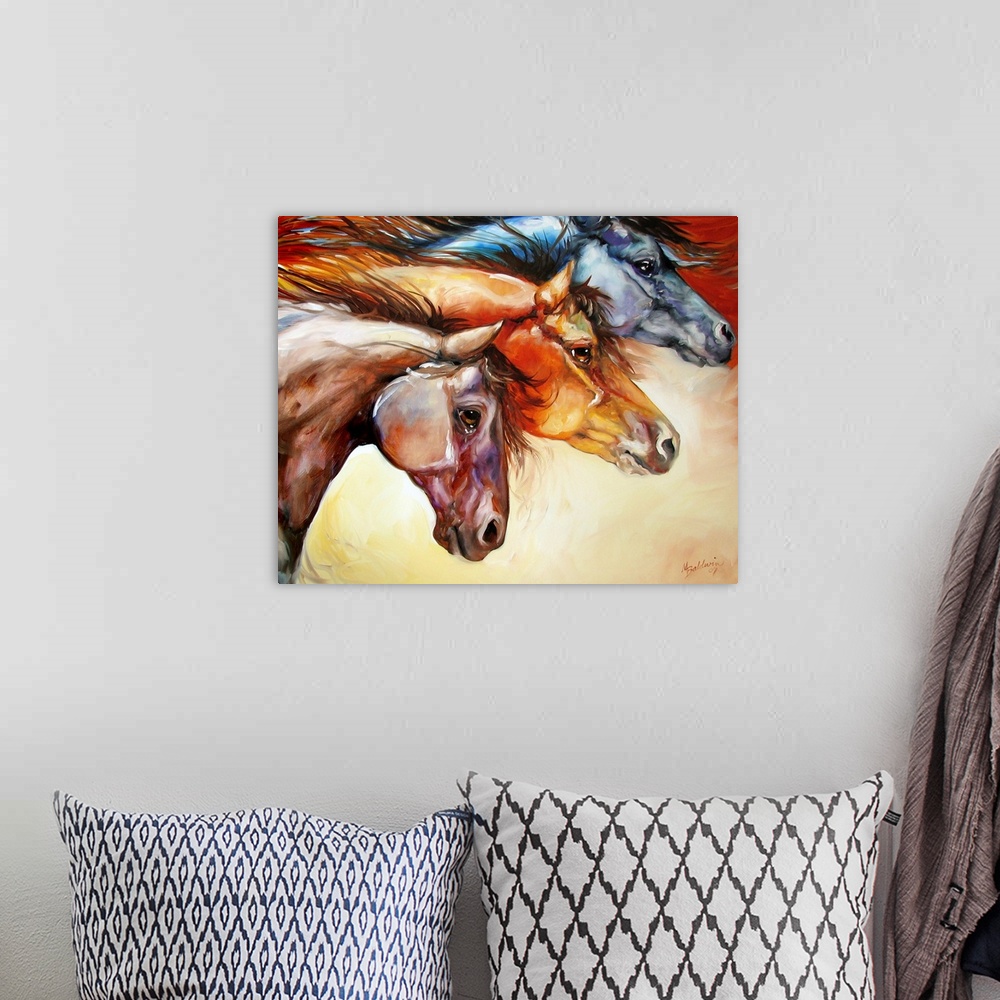 A bohemian room featuring Contemporary painting of three different colored horses moving together, displaying power and str...