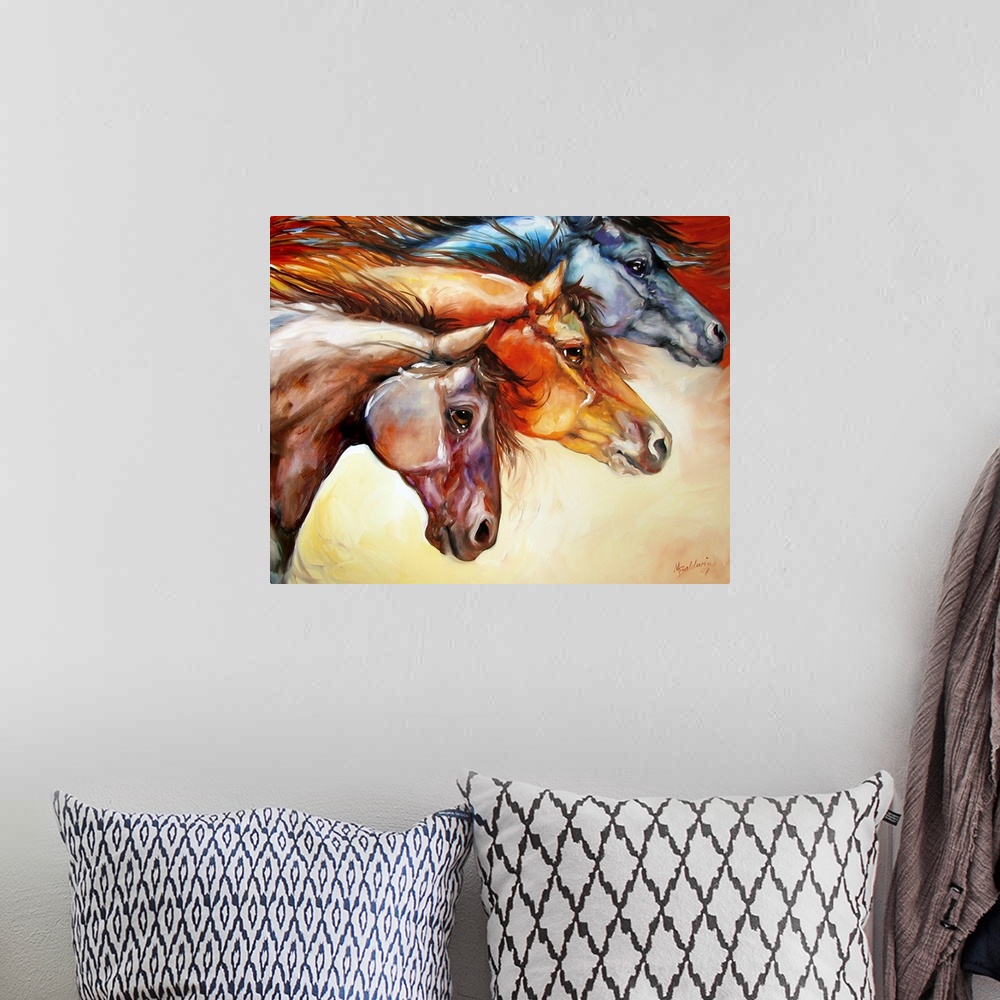 A bohemian room featuring Contemporary painting of three different colored horses moving together, displaying power and str...