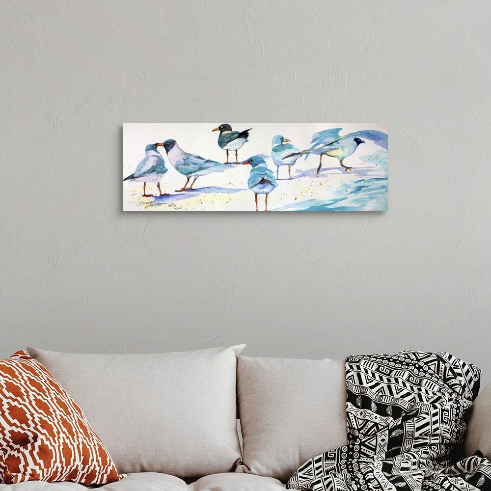 A bohemian room featuring A watercolor painting of sandpipers enjoying the white sand.