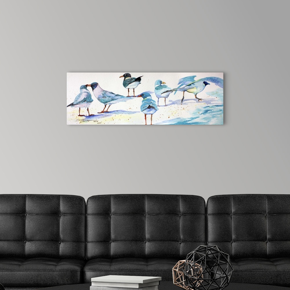 A modern room featuring A watercolor painting of sandpipers enjoying the white sand.