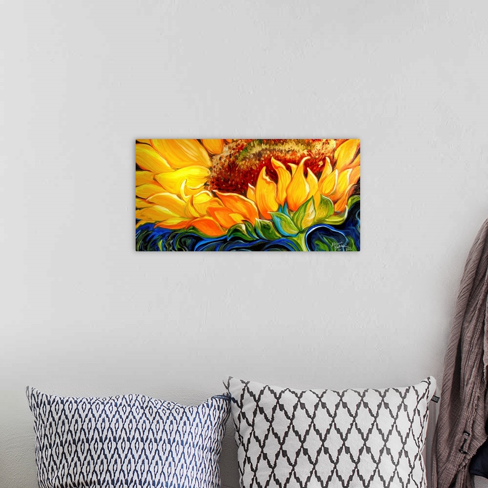 A bohemian room featuring Wide painting of a sunflower close up with an abstract blue, black, and green background.