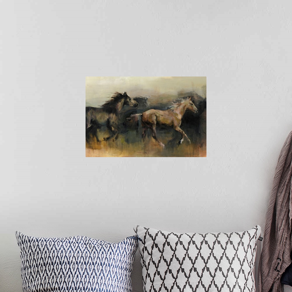 A bohemian room featuring Contemporary painting of a black and a brown horse galloping in the western desert.
