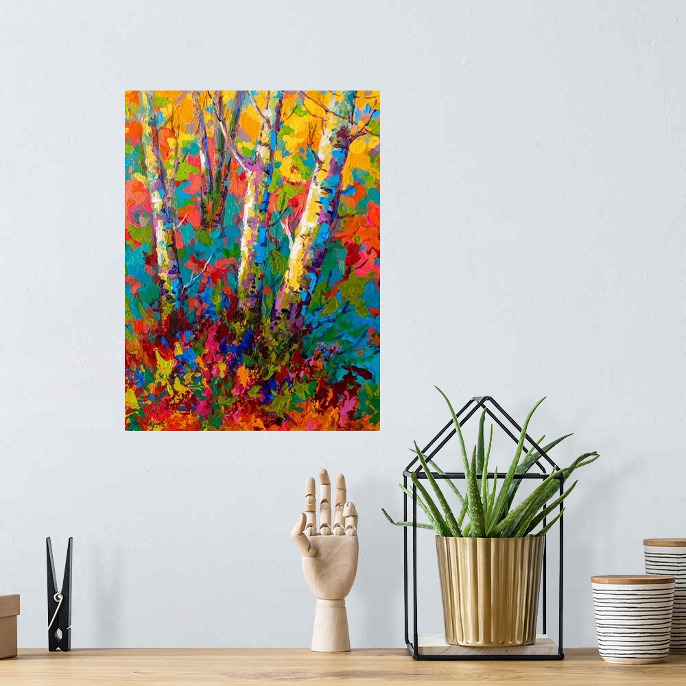 A bohemian room featuring Large contemporary art depicts the bases of a few bare trees surrounded by a vibrantly colored ba...