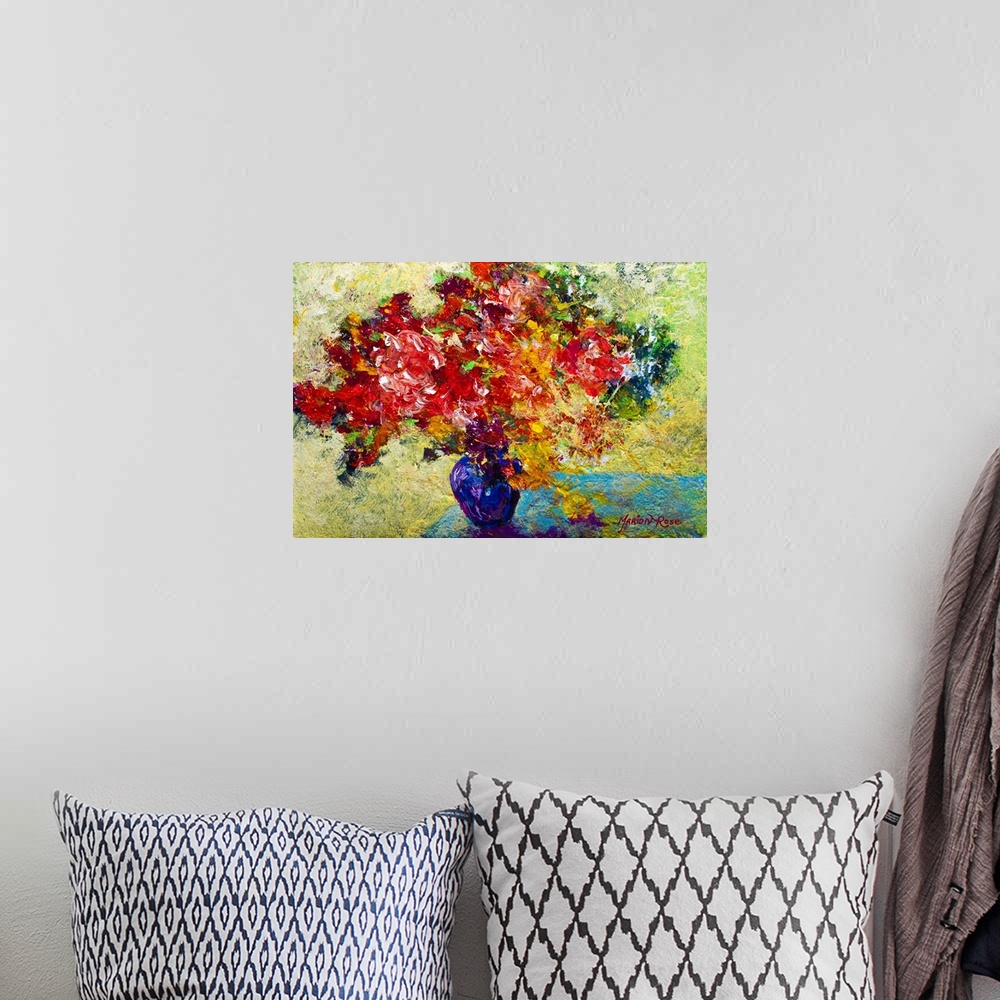A bohemian room featuring Textured painting of flower filled vase on table.