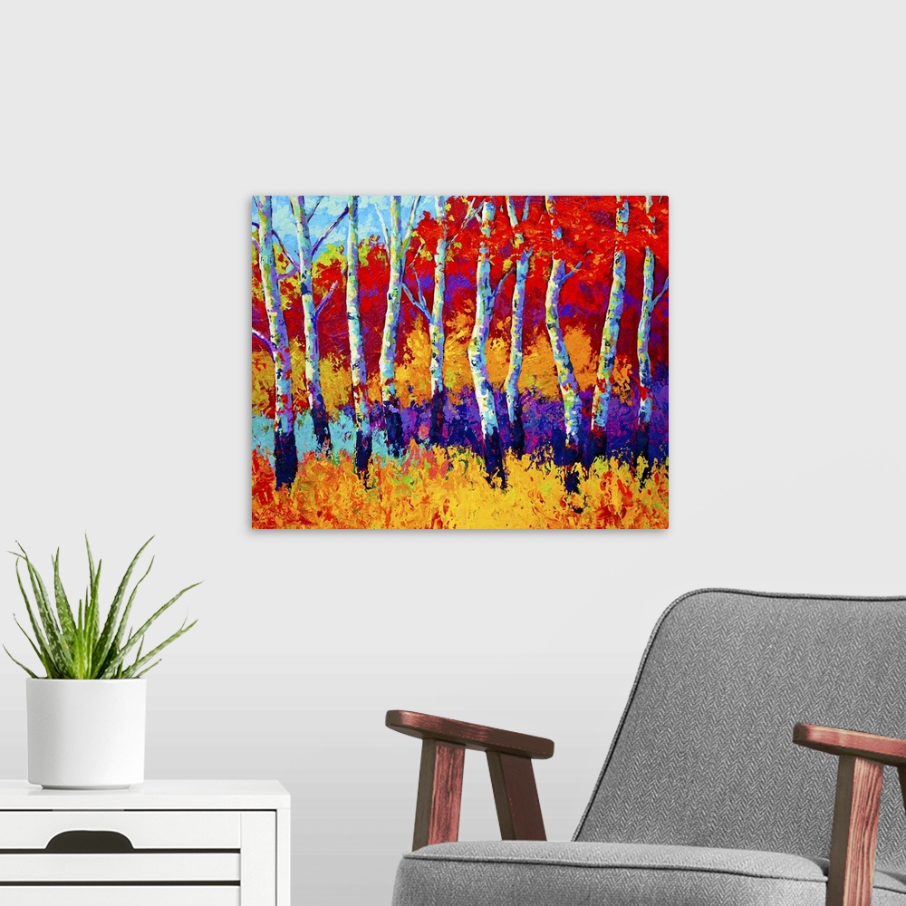 A modern room featuring Large abstractly painted canvas print of a line of trees with fall foliage in the background.