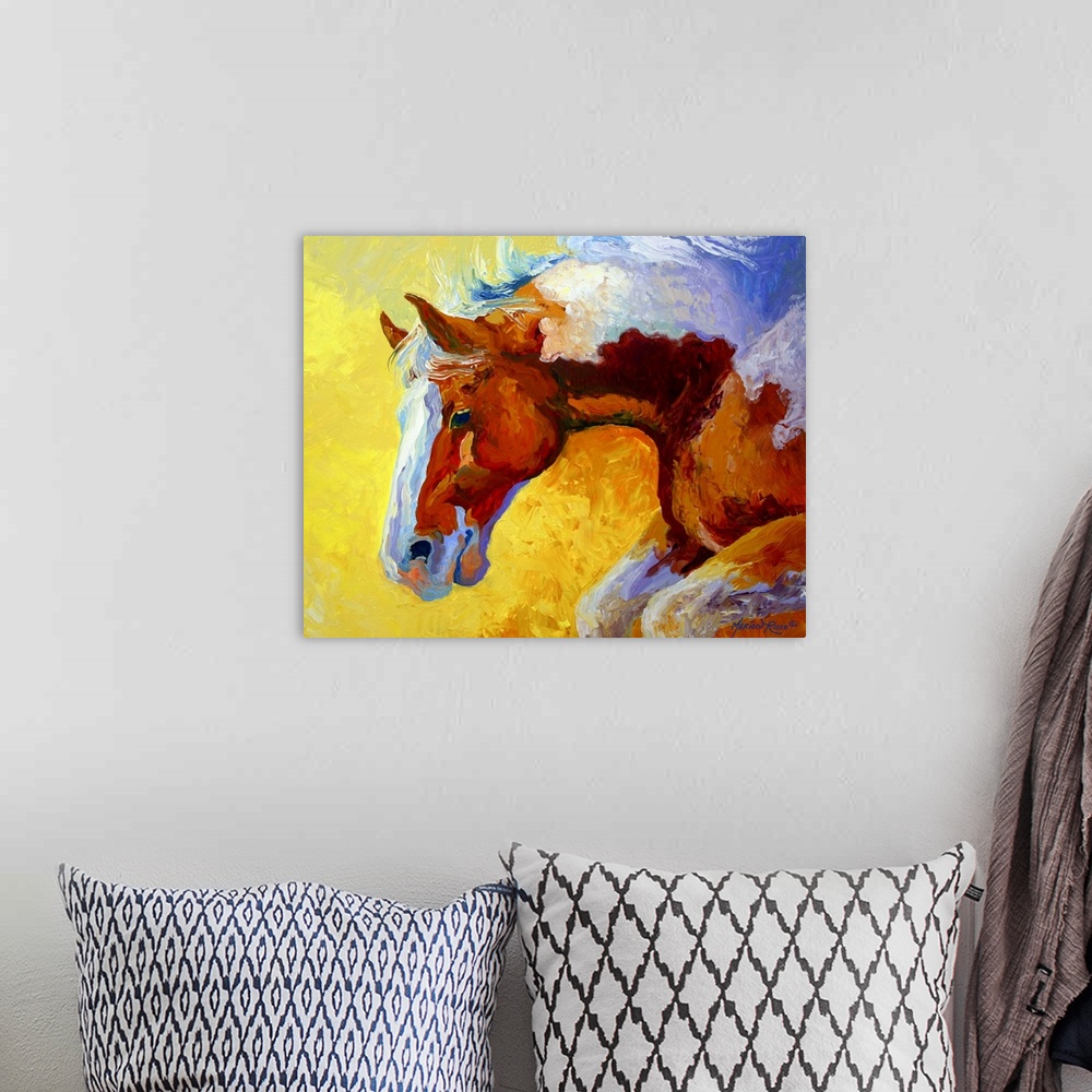 A bohemian room featuring A brightly colored contemporary painting of a charging Paint stallion, his neck arched as he gall...
