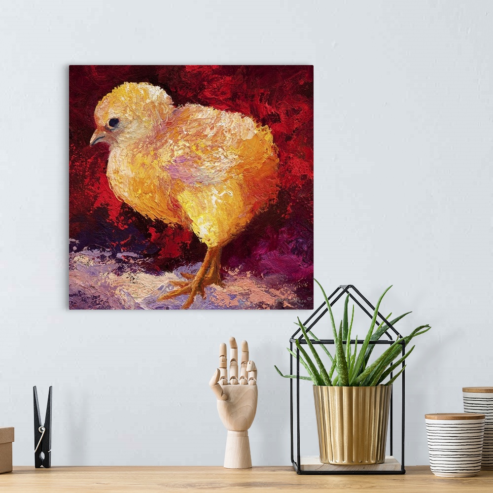 A bohemian room featuring Brightly colored painting of a newborn chick with vibrant red and orange tones.