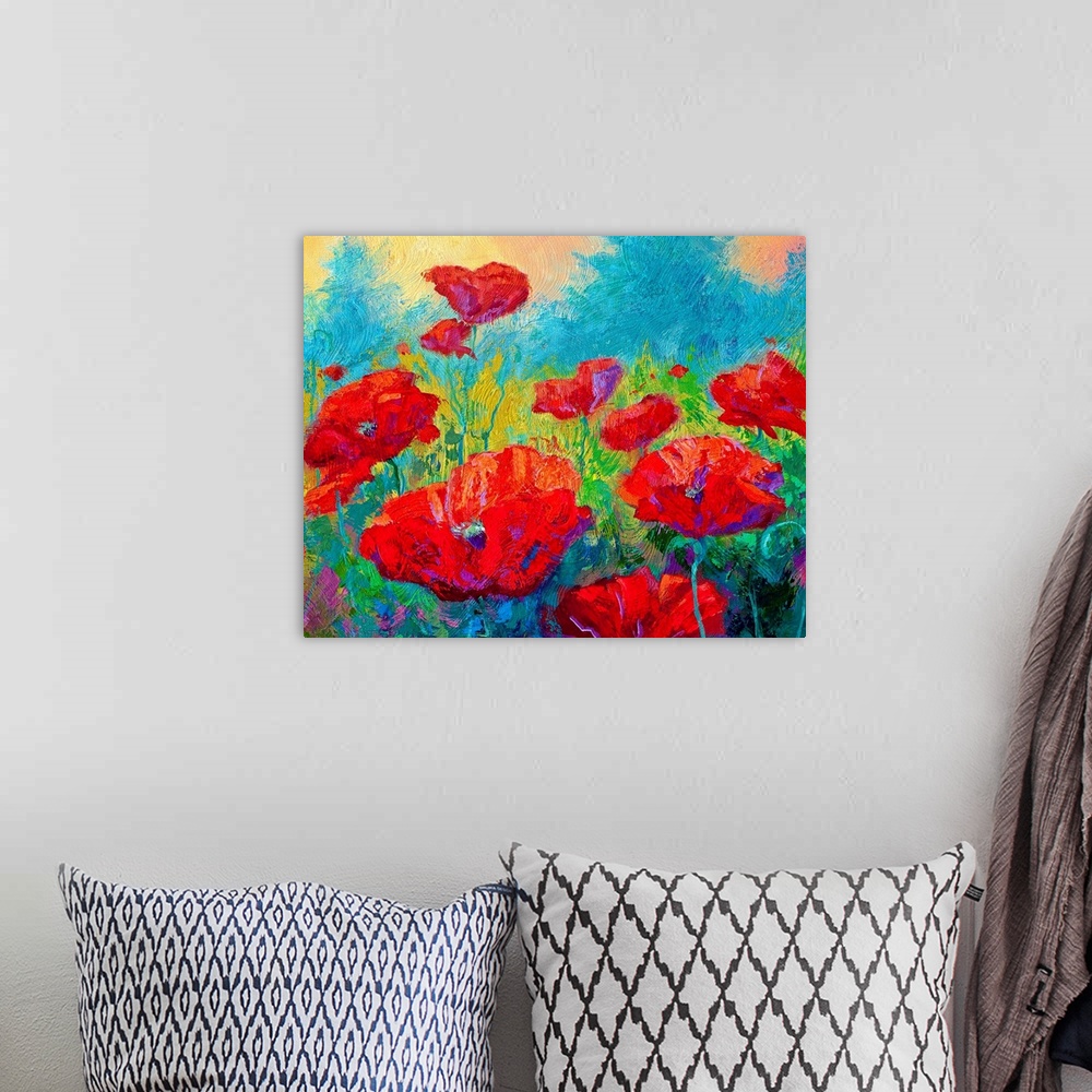 A bohemian room featuring Contemporary painting of a brightly colored field of flowers with a forest and warm sky in the ba...