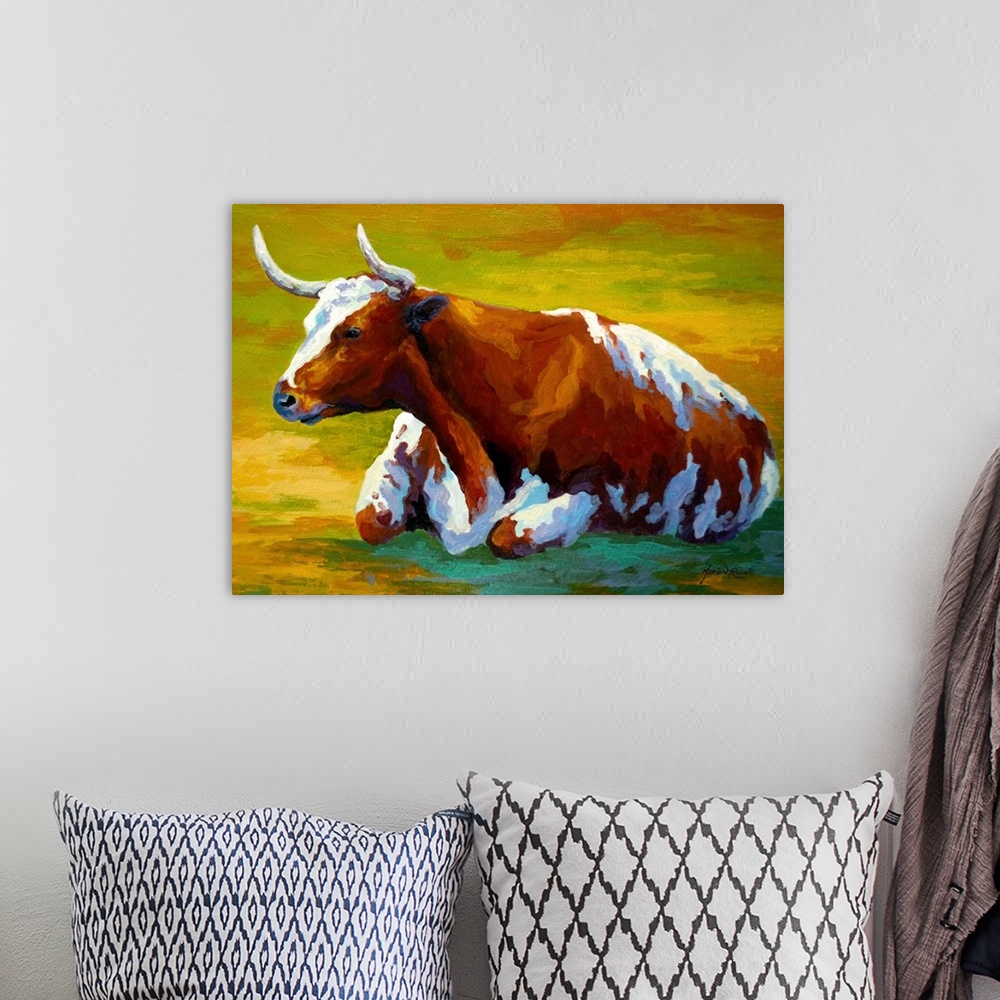 A bohemian room featuring Large painting of a cow in a field.