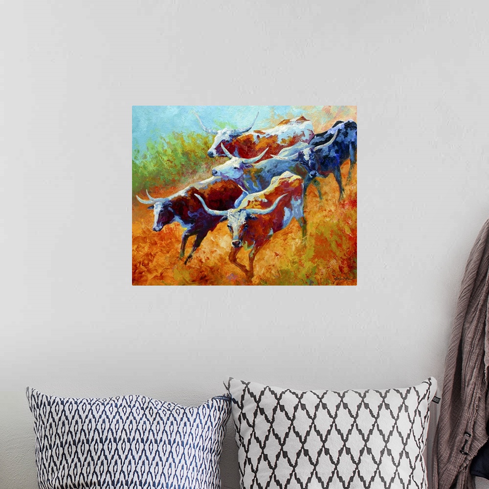 A bohemian room featuring Big landscape painting of a small group of longhorn cattle running down a grassy hill.   Painted ...