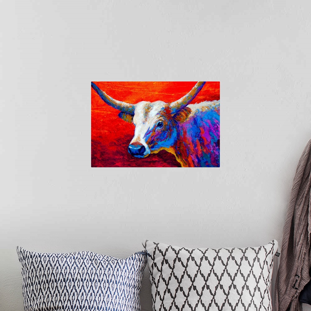 A bohemian room featuring Contemporary art painting of a longhorn cow in brilliant colors on a red sunset background.