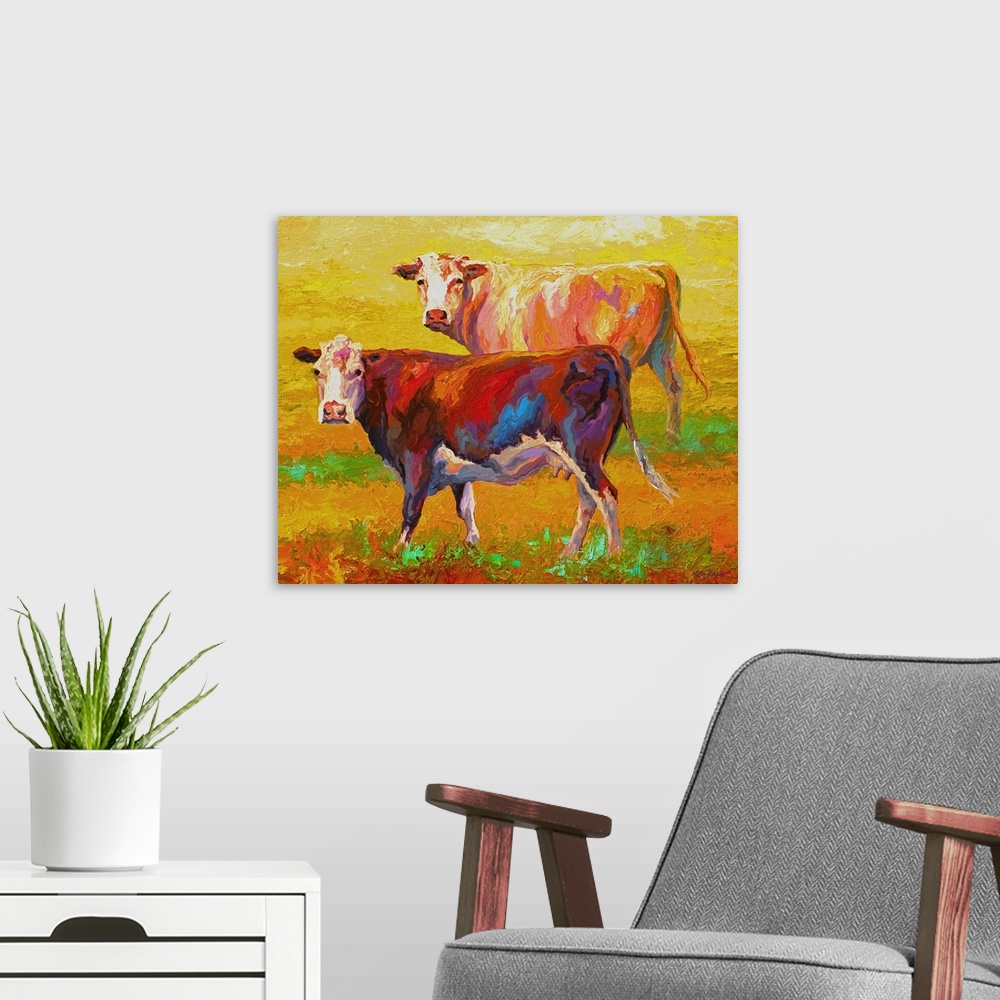 A modern room featuring A pair of cows looking forward on a brightly-painted landscape.