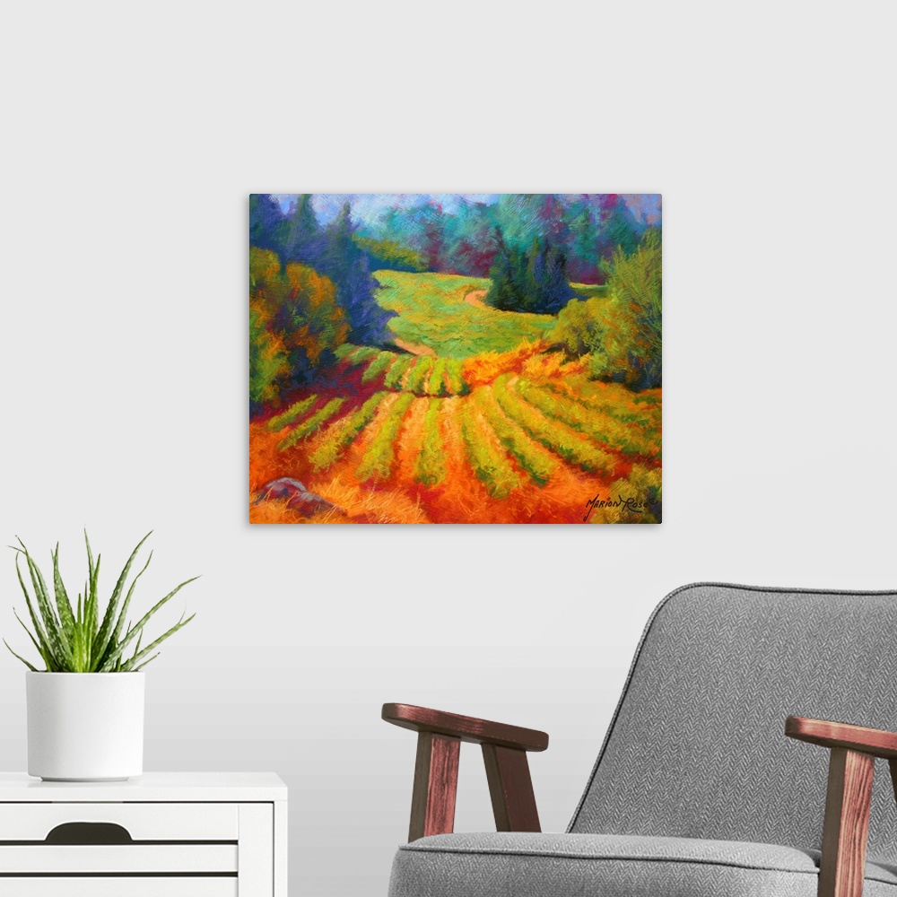 A modern room featuring Big painting on canvas of a  vineyard with a forest and rolling hills in the background.
