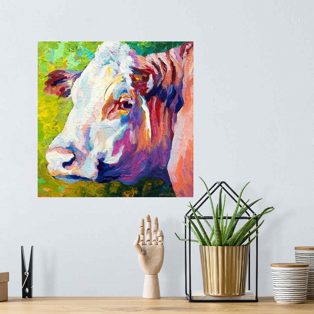 A bohemian room featuring A portrait of a cow is painted as it turns its head to look backward.