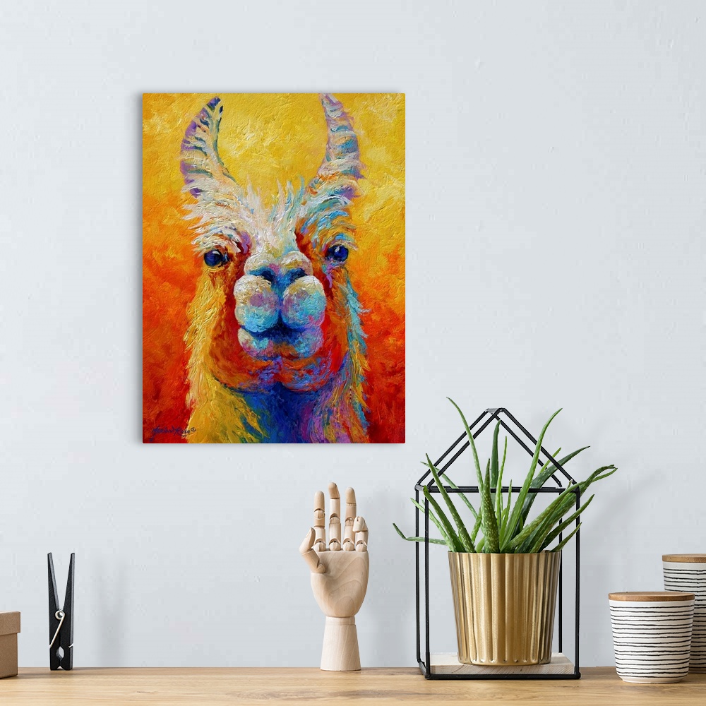 A bohemian room featuring Colorful painting looking straight on at the face of a llama with his ears sticking straight up.