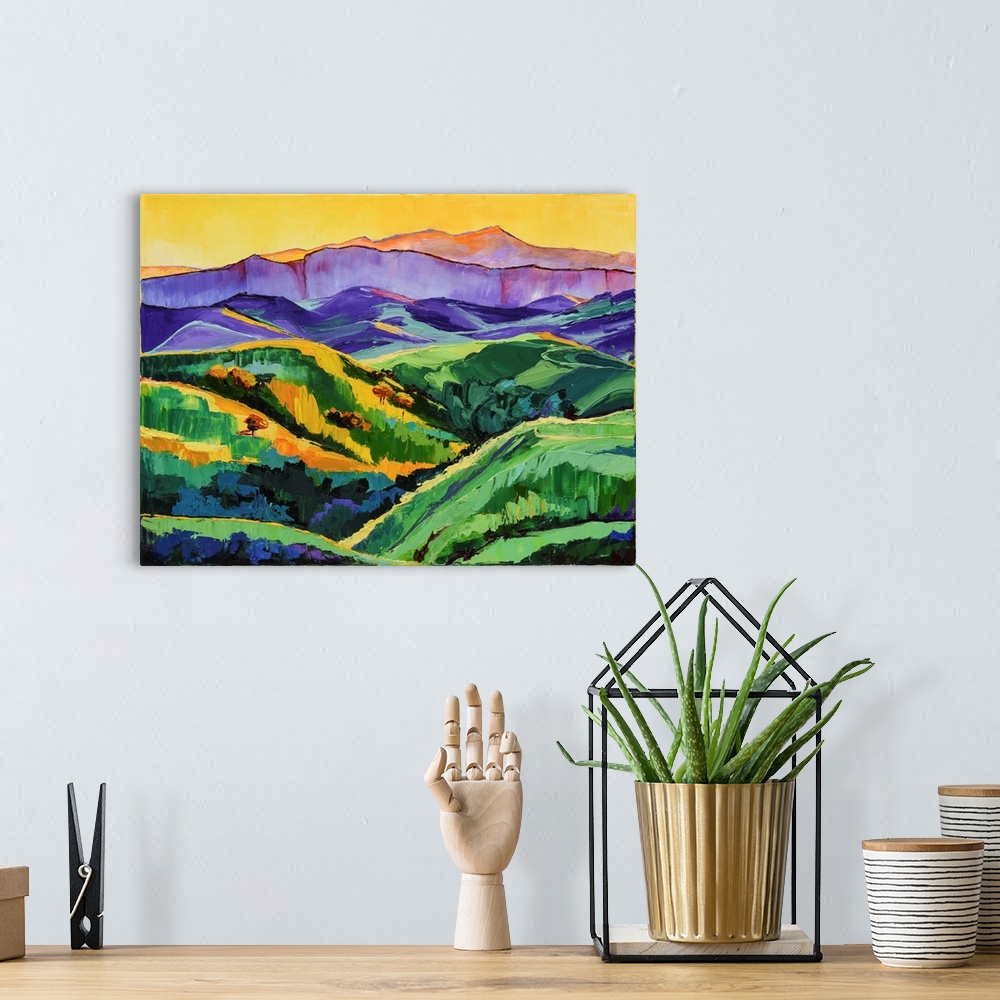 A bohemian room featuring Scene of verdant mountains and valley.