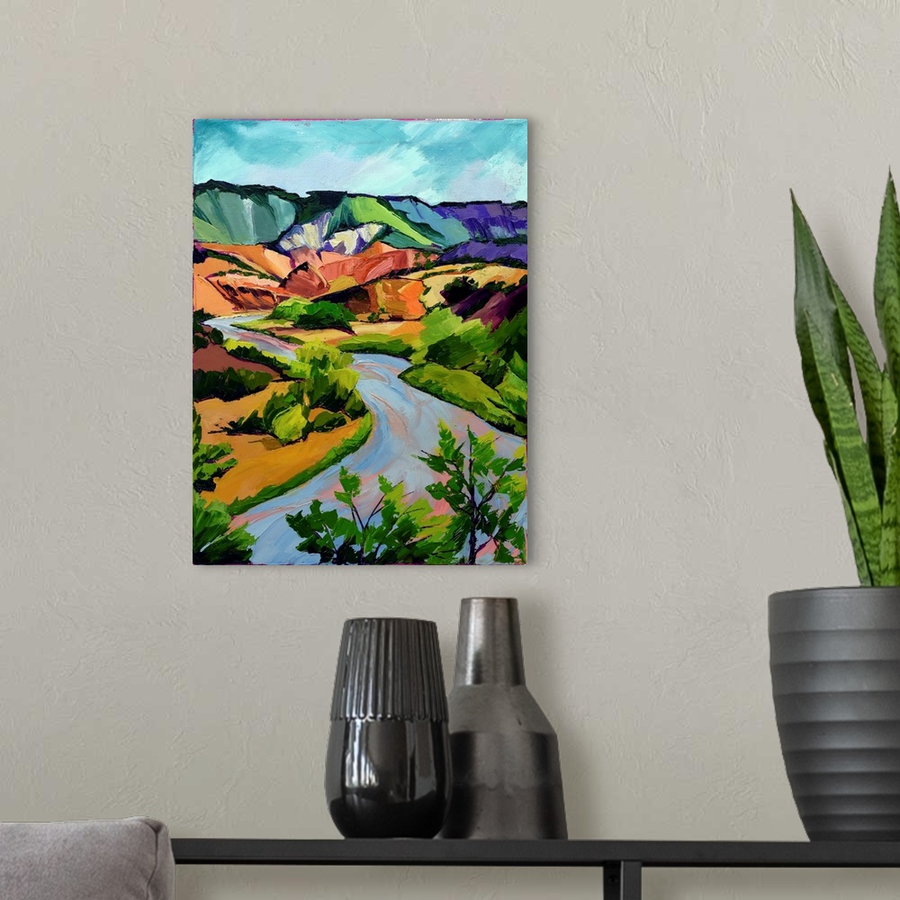 A modern room featuring Scene in New Mexico of mountains, river, and valley in vivid colors.