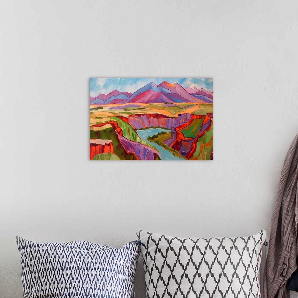 A bohemian room featuring View of Southwest with mountains, river, and cliffs in vivid color.