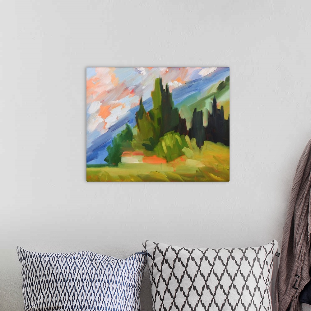 A bohemian room featuring Hillside scene in Tuscany with colorful sky and trees.