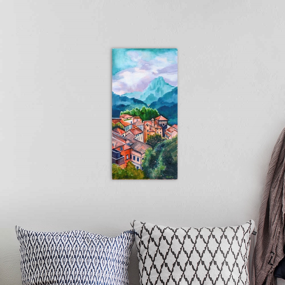 A bohemian room featuring Village in Tuscany with mountains in distance.