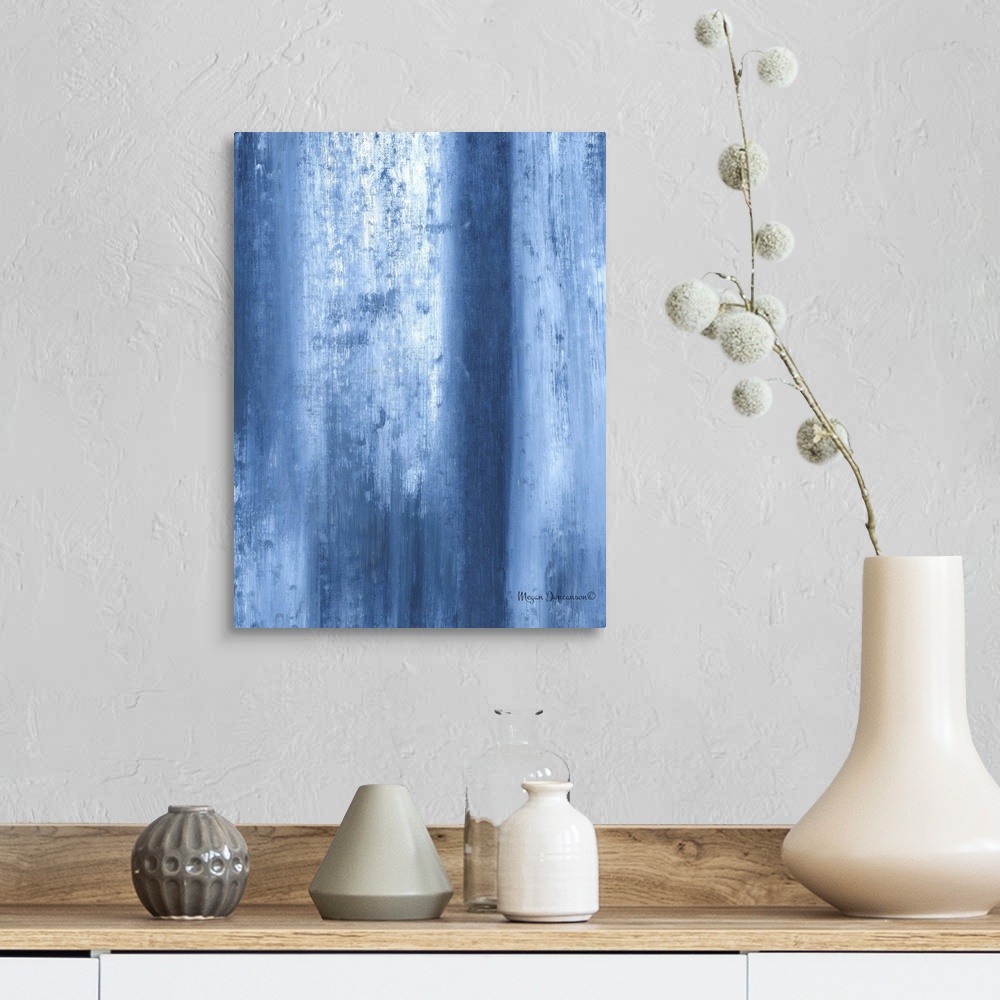 A farmhouse room featuring A contemporary abstract painting that has fading blue tones and white running vertically and gent...