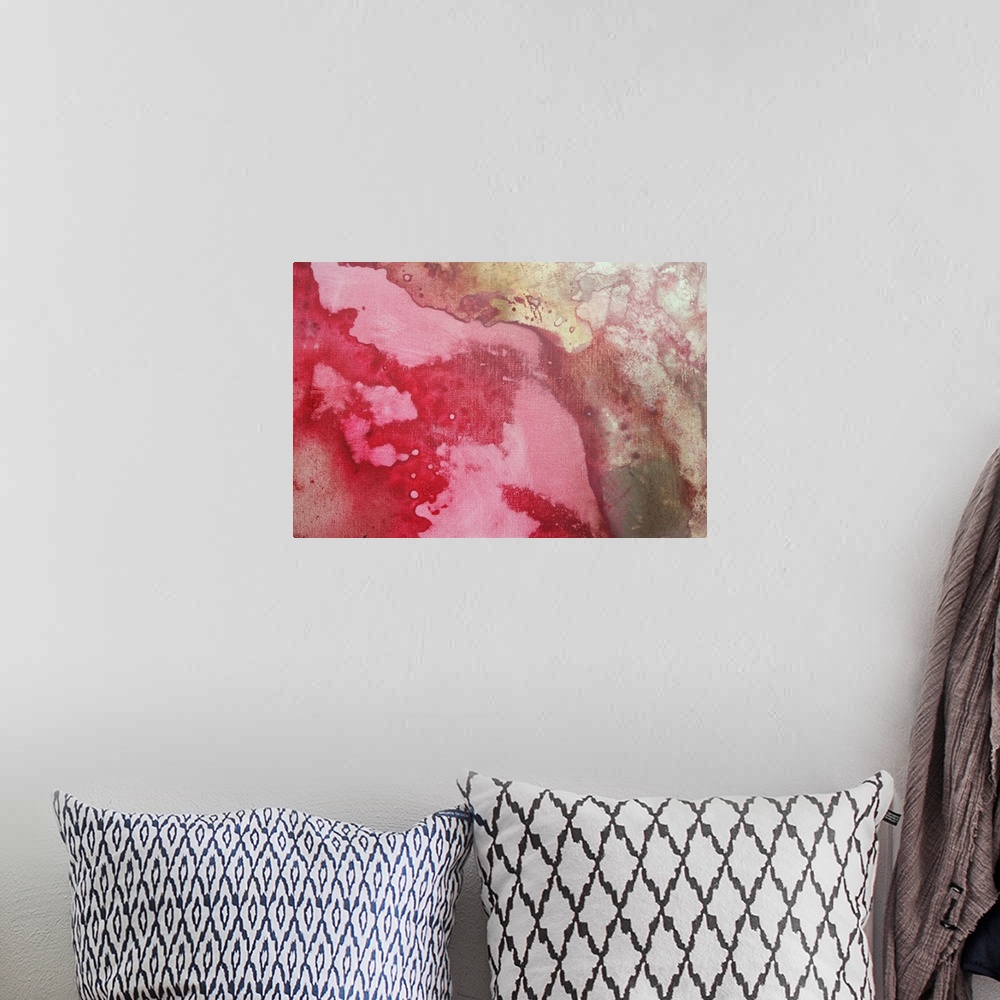 A bohemian room featuring Abstract artwork with various colors that appear to have bled together on the piece.