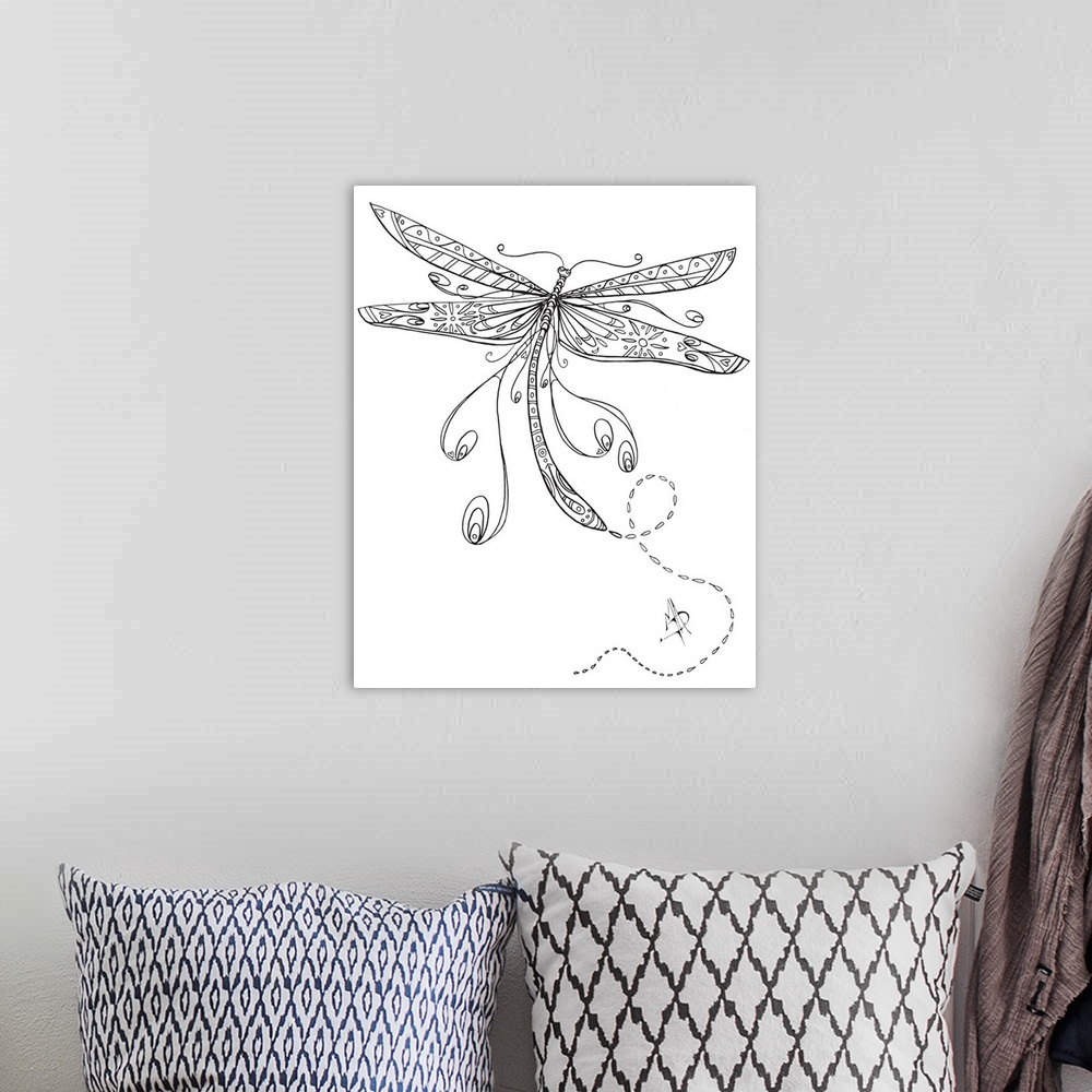 A bohemian room featuring Black and white line art of a dragonfly with large, patterned wings.