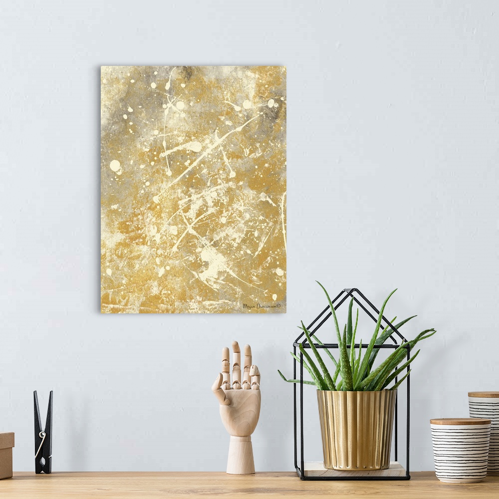 A bohemian room featuring A contemporary abstract painting with a gold and grey background that has cream paint splattered ...