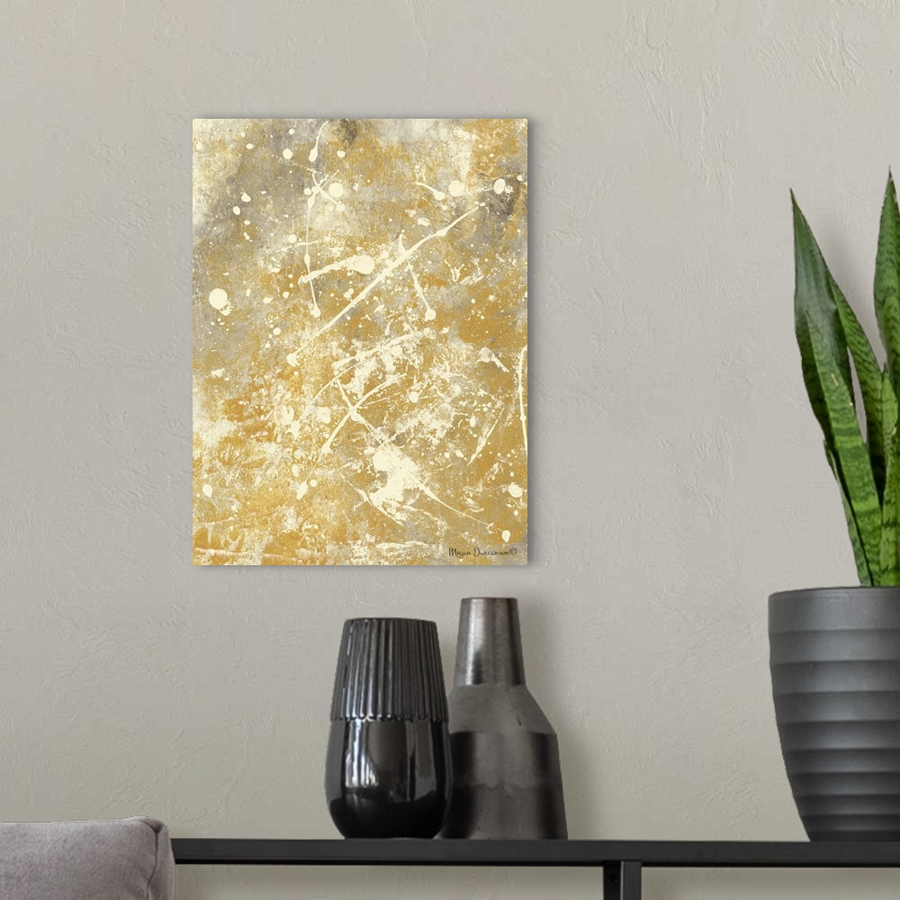 A modern room featuring A contemporary abstract painting with a gold and grey background that has cream paint splattered ...