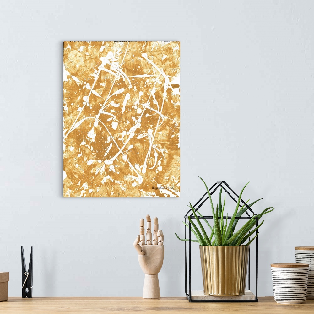 A bohemian room featuring A contemporary abstract painting with a gold background that has white that has white paint splat...