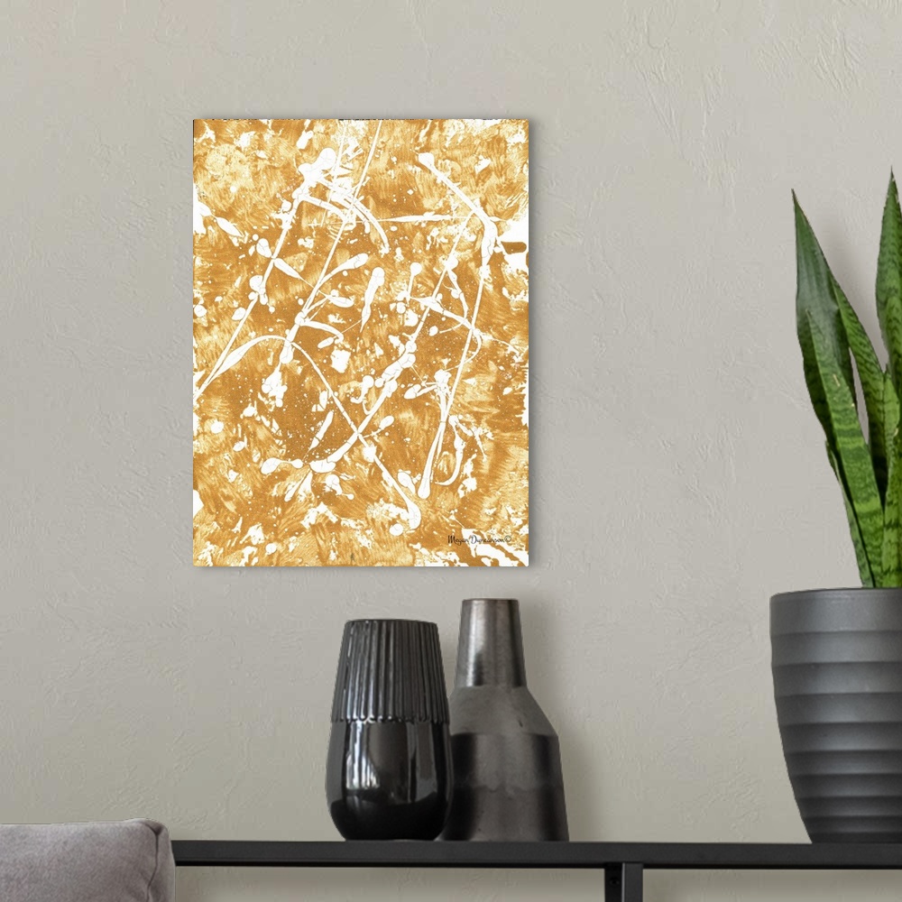 A modern room featuring A contemporary abstract painting with a gold background that has white that has white paint splat...