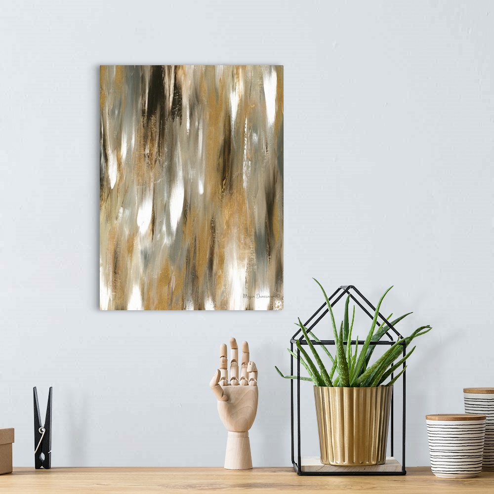 A bohemian room featuring A contemporary abstract painting that has a variety of brown and gold tones along with a little b...