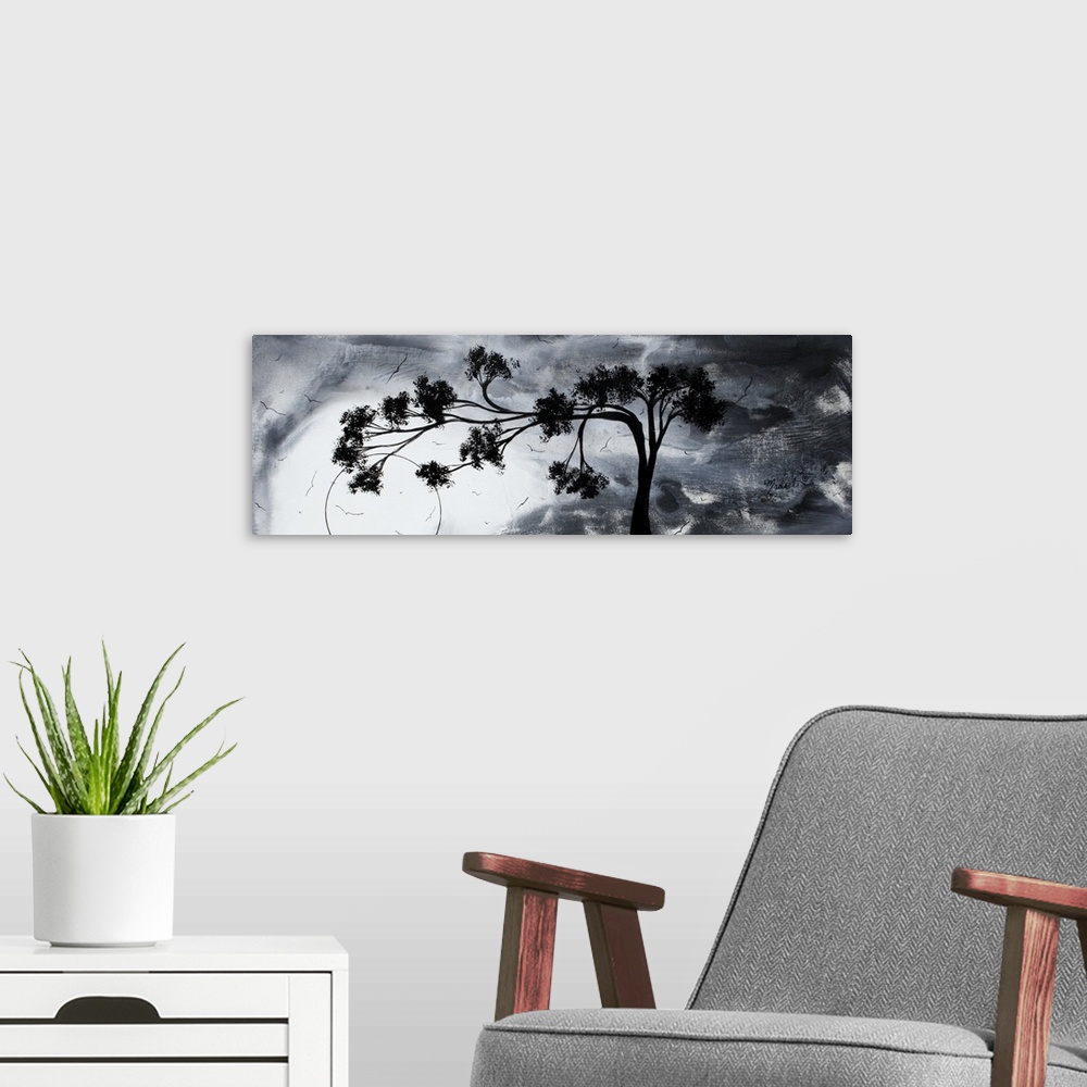 A modern room featuring Abstract artwork of a silhouetted tree that reaches far to the left against a gloomy sky with sev...