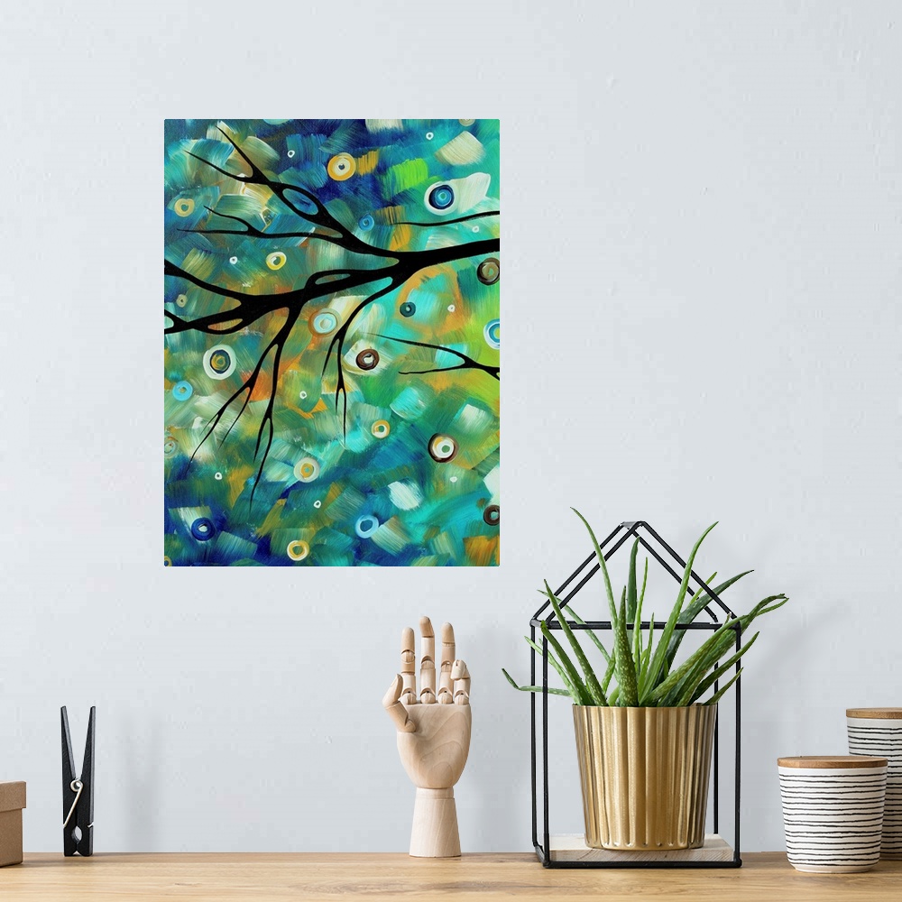A bohemian room featuring Huge contemporary art depicts the silhouette of a bare tree branch sitting in front of a backdrop...